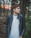 Photo of a Man Wearing Black Leather Jacket